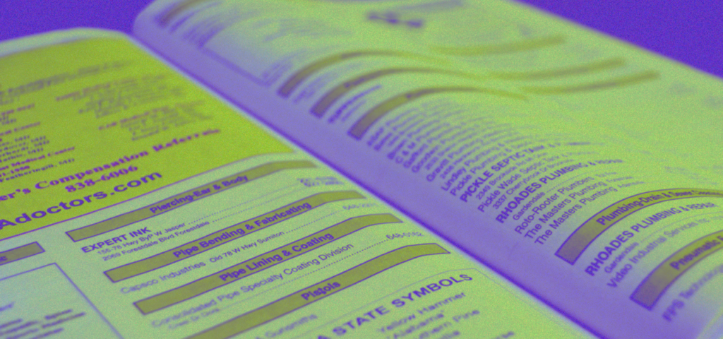 An old Yellow Pages book opened to show listings of various businesses.